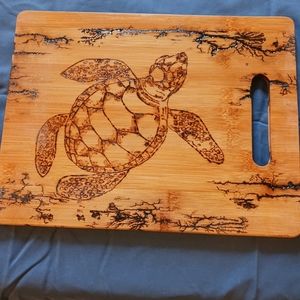 Turtle cutting board done in wood burning and wood lightning art.